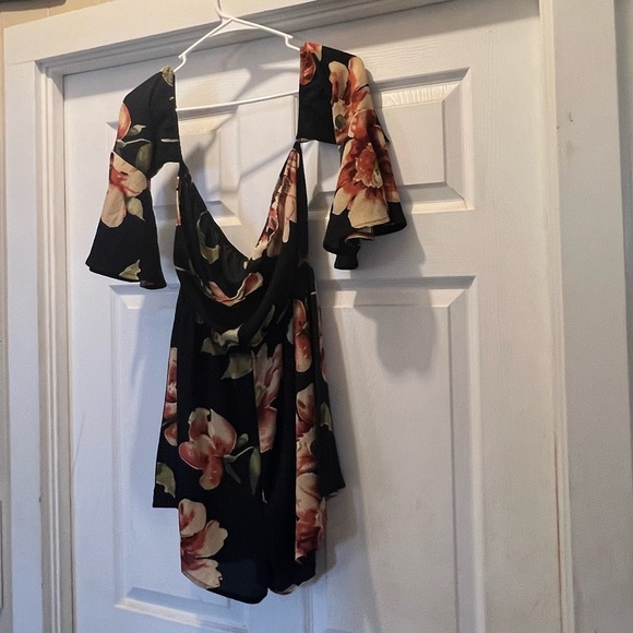 NWOT. Black flowy floral off the shoulder 3/4 sleeve romper. - Picture 7 of 11